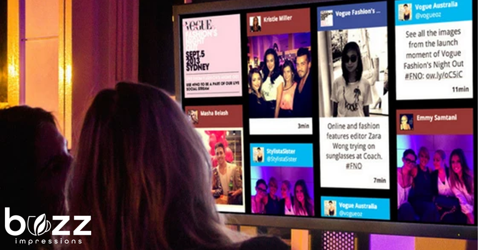 Social Media Walls: How to Increase Engagement in a Fun Way! 4 Attendees Viewing Social Media Wall