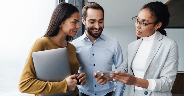 Authentic Trade Show Talking Points You Need to Know 3 Professionals Discussing Trade Show Talking Points